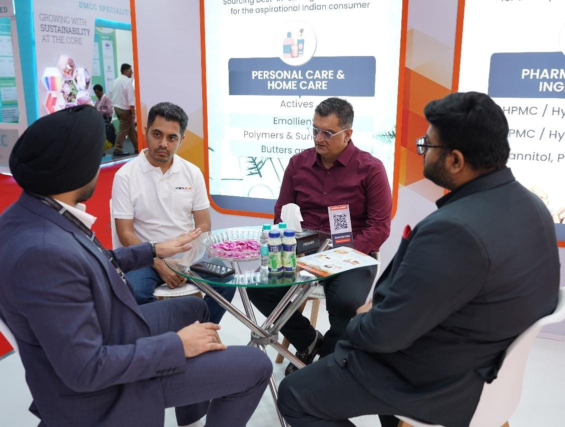 Industry professionals networking at Chemical Market exhibition booth