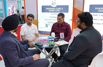Industry professionals networking at Chemical Market exhibition booth