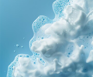 Close-up of cleansing foam representing surfactant properties for effective cleaning